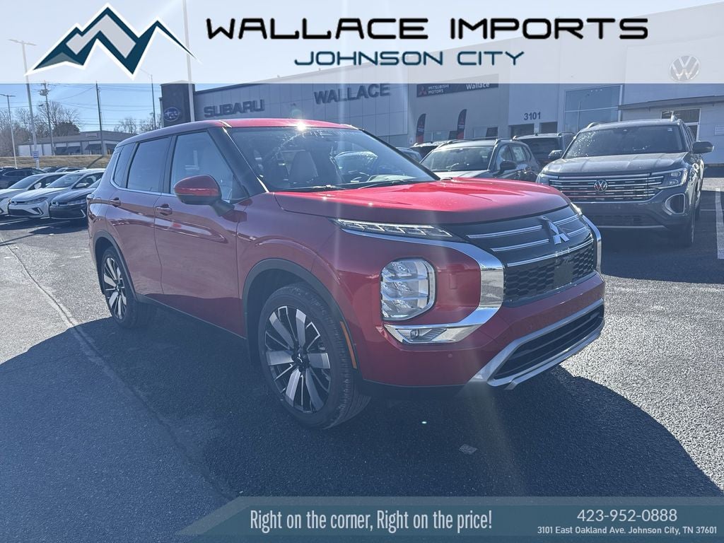 2025 Mitsubishi Outlander SE in Red Diamond — front three-quarter view